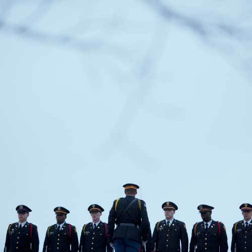 Police officers saluting.