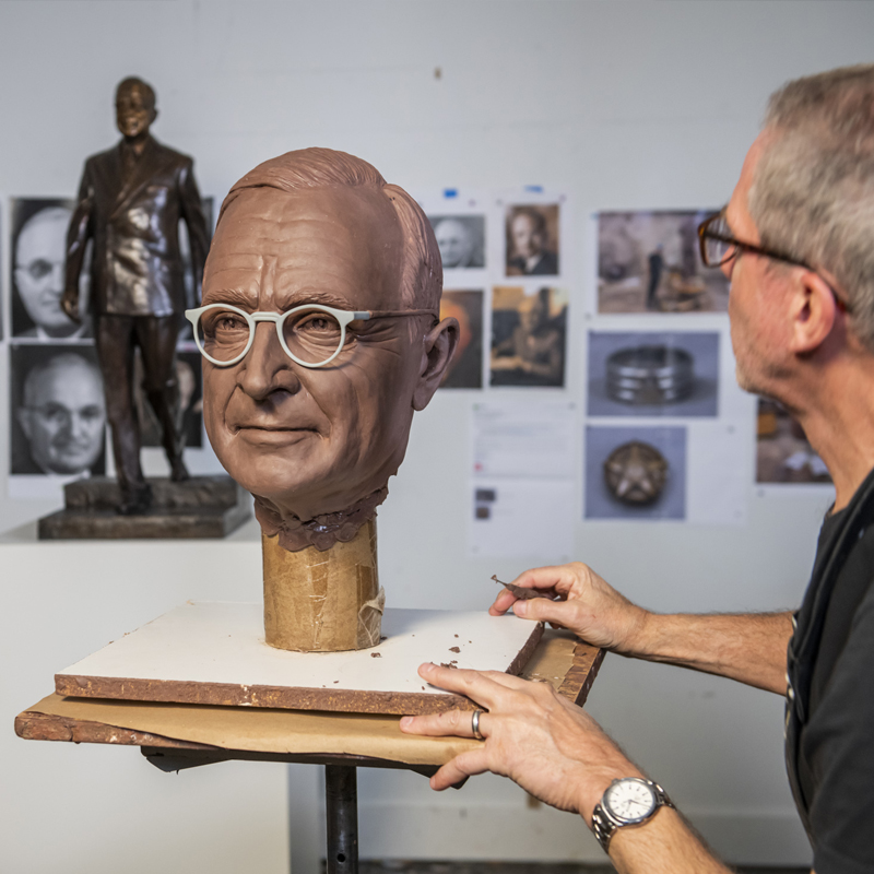 Tom Corbin sculptor working on the Truman Statue